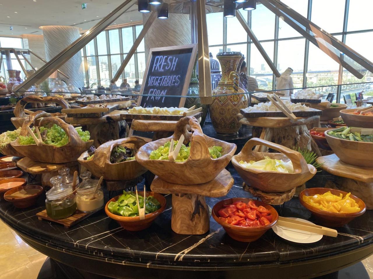 Movenpick Hotel And Residences Riaad Buitenkant foto A salad bar at a hotel