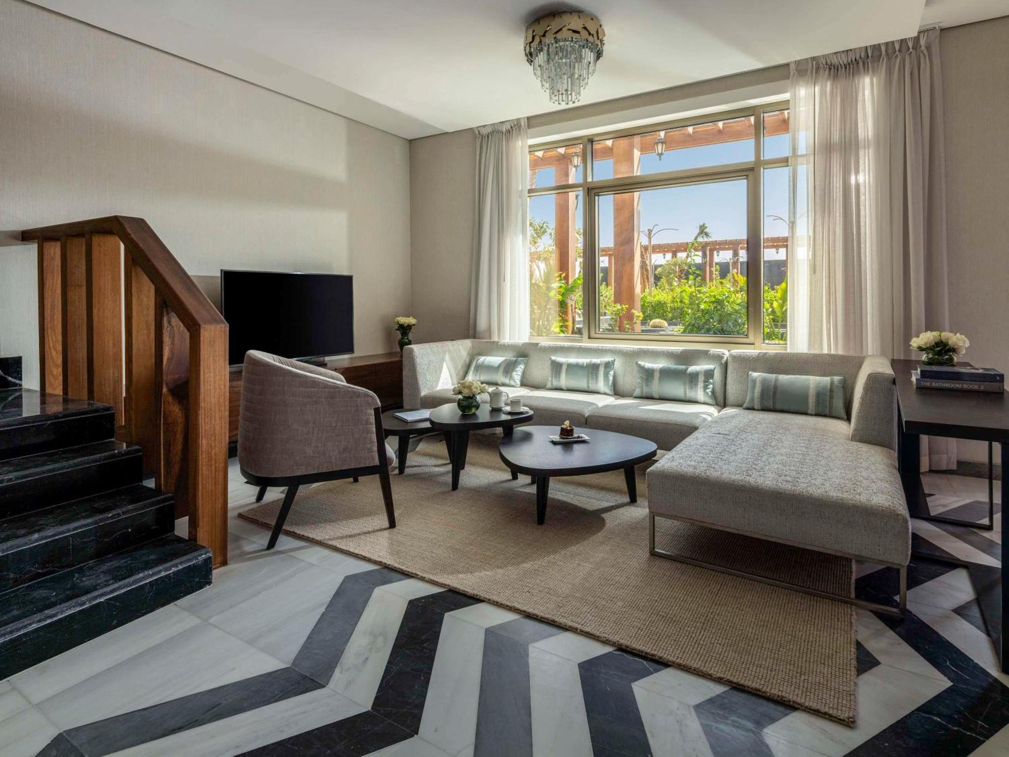 Movenpick Hotel And Residences Riaad Buitenkant foto A living room at the hotel